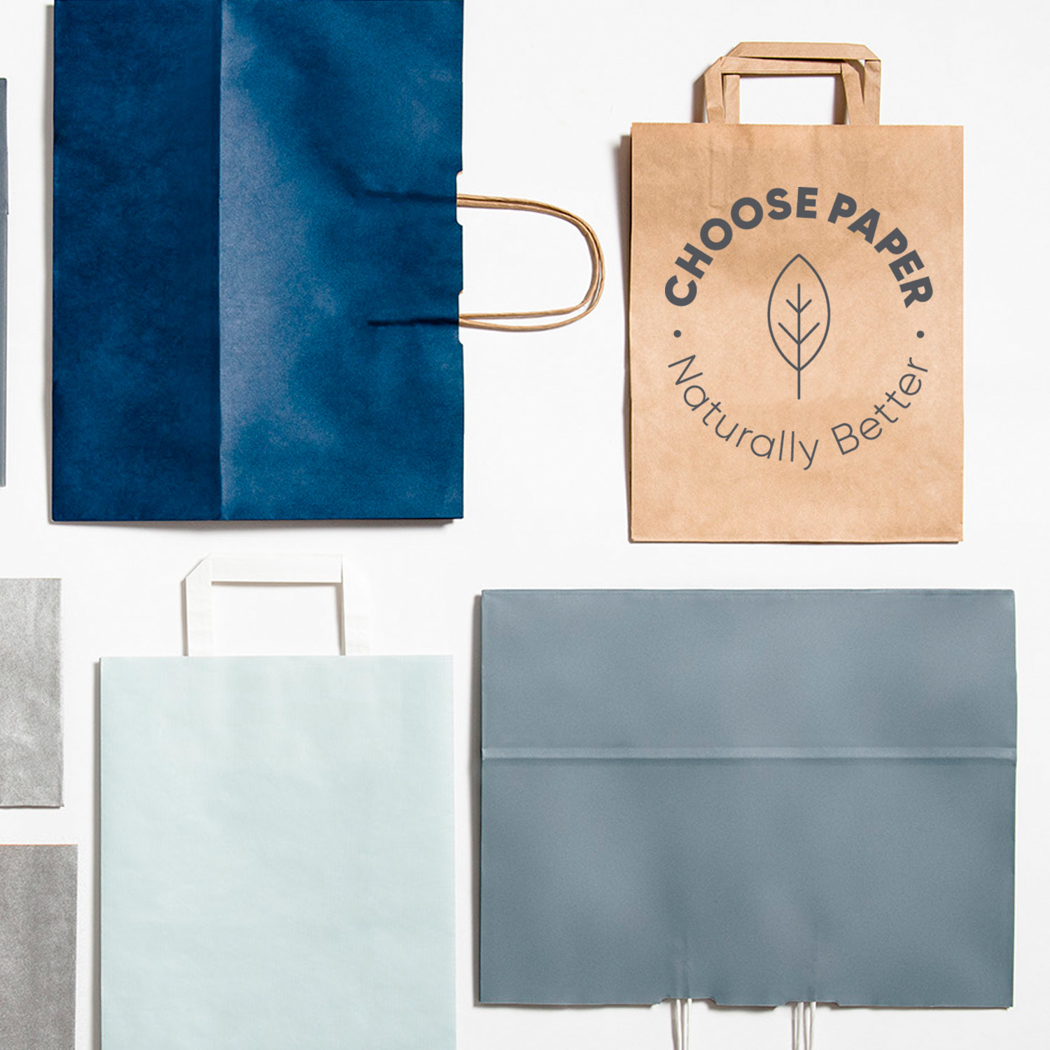 Image of carry bags lying flat with statement 'Choose Paper. Naturally Better'. 