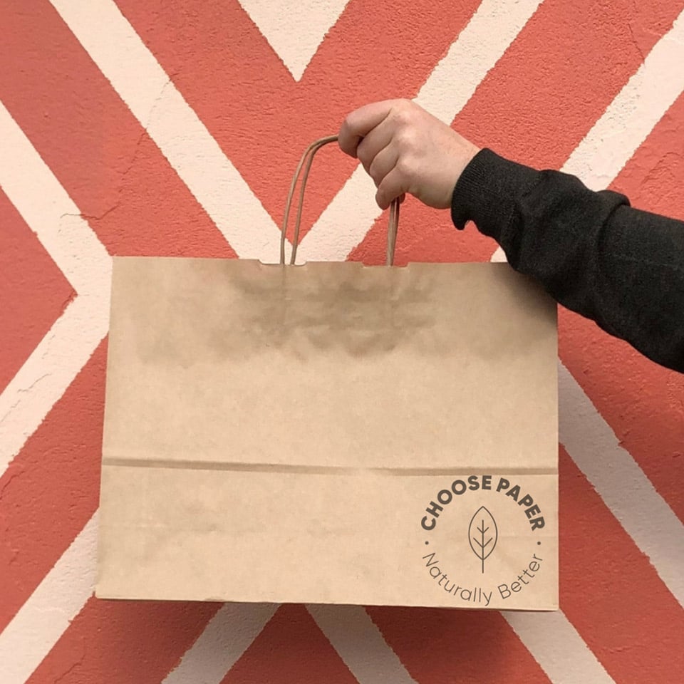 Image of paper bag against a wall with icon stating choose paper naturally better