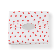 premium white tissue paper with small red hearts